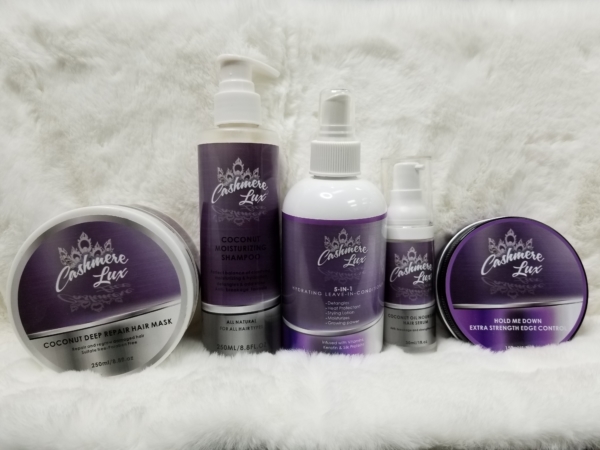 Purple Activated Shampoo & Conditioner Bundle on a white fur rug.