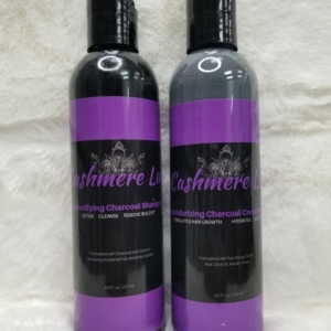 Two bottles of hair care products on a white background.
